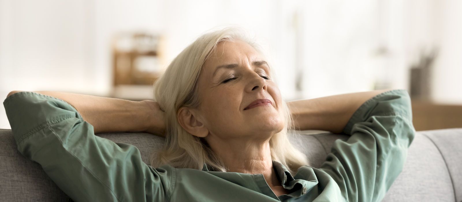 Relaxed woman resting with eyes closed after psychedelic assisted therapy session, individual PAT support and trauma healing services on Vancouver Island.